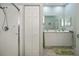 Bathroom featuring double sinks and a walk in shower at 1355 Red Oak Ln, Port Charlotte, FL 33948
