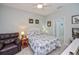 Comfortable bedroom with a ceiling fan, a queen-sized bed and relaxing decor at 1355 Red Oak Ln, Port Charlotte, FL 33948