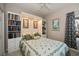 Comfortable bedroom featuring built-in shelving and a stained glass window at 1355 Red Oak Ln, Port Charlotte, FL 33948