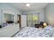 Bedroom featuring a dresser, bed, end table and natural light from the window at 1355 Red Oak Ln, Port Charlotte, FL 33948