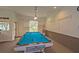 Billiards room with a well-maintained pool table, providing residents with a fun and recreational space for leisure activities at 1355 Red Oak Ln, Port Charlotte, FL 33948