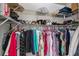 Organized walk-in closet with shelving and hanging rods, providing ample storage space at 1355 Red Oak Ln, Port Charlotte, FL 33948