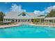 Stunning community pool with ample seating and well-maintained landscaping, creating an ideal resort-style atmosphere for residents at 1355 Red Oak Ln, Port Charlotte, FL 33948