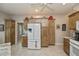 Spacious kitchen featuring abundant cabinet storage and modern white appliances at 1355 Red Oak Ln, Port Charlotte, FL 33948