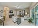 Comfortable living room with neutral paint, updated furniture, and open access to other living areas at 1355 Red Oak Ln, Port Charlotte, FL 33948