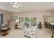 Open floor plan featuring a comfortable living room area leading to a bright kitchen at 1355 Red Oak Ln, Port Charlotte, FL 33948