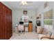 Cozy home office with built-in storage, a desk, and a comfortable chair for remote work at 1355 Red Oak Ln, Port Charlotte, FL 33948