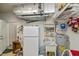 Functional utility room with a sink, water heater, and storage shelves at 1355 Red Oak Ln, Port Charlotte, FL 33948