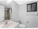 Bathroom with a glass-enclosed shower, vanity, and toilet at 1356 Rio De Janeiro Ave # 107, Punta Gorda, FL 33983