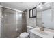 Bathroom with a glass-enclosed shower, vanity, and toilet at 1356 Rio De Janeiro Ave # 107, Punta Gorda, FL 33983