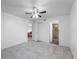 Spacious bedroom features tile flooring, ceiling fan, and direct access to the bathroom and closet at 1356 Rio De Janeiro Ave # 107, Punta Gorda, FL 33983