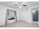 Spacious bedroom features tile flooring, ceiling fan, and direct access to the closet at 1356 Rio De Janeiro Ave # 107, Punta Gorda, FL 33983