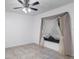 Bright bedroom with neutral walls, tile flooring, ceiling fan, and a window with curtains at 1356 Rio De Janeiro Ave # 107, Punta Gorda, FL 33983