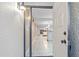 View through the open front door showcasing the tiled entryway and living space with views to the lanai at 1356 Rio De Janeiro Ave # 107, Punta Gorda, FL 33983