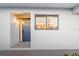 Inviting entrance featuring a blue front door, exterior light fixture, and window with a view into the home at 1356 Rio De Janeiro Ave # 107, Punta Gorda, FL 33983