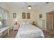 Bright bedroom with white furniture, ceiling fan, and neutral decor for a cozy atmosphere at 1474 Red Oak Ln, Port Charlotte, FL 33948