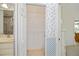 Walk-in closet with a tile floor and wire shelving adjacent to the Primary bathroom at 1474 Red Oak Ln, Port Charlotte, FL 33948