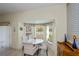 Bright dining nook with bay window, tile floors and white dining set at 1474 Red Oak Ln, Port Charlotte, FL 33948