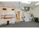 Functional garage space with storage cabinets, utility sink, and ample workspace at 1474 Red Oak Ln, Port Charlotte, FL 33948