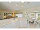 Bright kitchen with a breakfast bar that opens into the dining and living area for easy entertaining at 1474 Red Oak Ln, Port Charlotte, FL 33948
