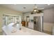 Bright kitchen featuring white countertops, stainless steel refrigerator, adjacent breakfast nook with bay window at 1474 Red Oak Ln, Port Charlotte, FL 33948