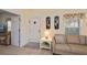 Bright and airy living room featuring tile floors, a comfortable sofa, and neutral decor at 1474 Red Oak Ln, Port Charlotte, FL 33948