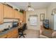Home office with built-in cabinets, desk space, and neutral decor at 1474 Red Oak Ln, Port Charlotte, FL 33948