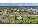 Wide aerial view of the real estate, highlighting its location within a scenic neighborhood with lakes and green spaces at 16531 San Edmundo Rd, Punta Gorda, FL 33955