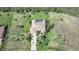 Aerial view of a home with a pool, surrounded by lush greenery and mature trees at 16531 San Edmundo Rd, Punta Gorda, FL 33955
