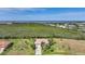 Expansive aerial view captures the home, lush greenery, and stunning waterfront scenery at 16531 San Edmundo Rd, Punta Gorda, FL 33955