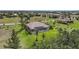 Expansive property featuring mature landscaping and a screened-in pool, captured from an aerial perspective at 16531 San Edmundo Rd, Punta Gorda, FL 33955