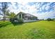 Sprawling backyard featuring lush greenery, mature trees, and privacy for relaxation and outdoor activities at 16531 San Edmundo Rd, Punta Gorda, FL 33955