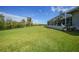 Lush backyard with tropical foliage, mature trees, and privacy for outdoor activities and relaxation at 16531 San Edmundo Rd, Punta Gorda, FL 33955