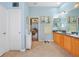 Well-lit bathroom boasts double sinks with wood cabinets and access to the main bedroom at 16531 San Edmundo Rd, Punta Gorda, FL 33955