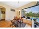 Charming breakfast nook with views of the backyard pool and garden, perfect for relaxed dining at 16531 San Edmundo Rd, Punta Gorda, FL 33955