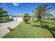 Lovely single-story home featuring a lush lawn, a circular driveway, and a convenient three-car garage at 16531 San Edmundo Rd, Punta Gorda, FL 33955