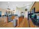 Well-lit kitchen with hardwood floors, stainless steel appliances, and a central island with a cooktop at 16531 San Edmundo Rd, Punta Gorda, FL 33955