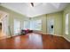 Spacious room with hardwood floors, windows, and access to an en-suite bathroom at 16531 San Edmundo Rd, Punta Gorda, FL 33955