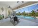A beautiful screened-in pool, patio and seating area, perfect for relaxation at 16531 San Edmundo Rd, Punta Gorda, FL 33955