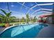 Inviting in-ground pool with a screened enclosure for year-round enjoyment at 16531 San Edmundo Rd, Punta Gorda, FL 33955