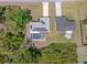 Backyard view of this property showing the pool and solar panels on the roof of the house at 1702 Rice Ter, North Port, FL 34286