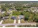 Aerial view of the property showing the driveway and landscaping of the front yard at 1702 Rice Ter, North Port, FL 34286