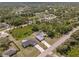 Neighborhood aerial view of the property showing the surrounding homes and lush trees at 1702 Rice Ter, North Port, FL 34286