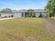 Attractive home with a manicured lawn and inviting curb appeal, offering a comfortable living space at 1702 Rice Ter, North Port, FL 34286