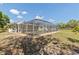 Spacious screened pool with exterior views, creating an inviting outdoor retreat at 1702 Rice Ter, North Port, FL 34286