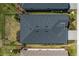 Aerial view of the roof of a house with landscaped yard, showcasing the home's architectural features and design at 17612 Fallen Branch Way, Punta Gorda, FL 33982