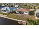 Aerial view of home showing the canal access and surrounding landscape at 18422 Arapahoe Cir, Port Charlotte, FL 33948