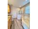 Bathroom features a garden tub and a separate glass door shower at 1859 Scarlett Ave, North Port, FL 34289