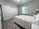 Comfortable bedroom featuring a large window, closet and neutral colored walls at 1859 Scarlett Ave, North Port, FL 34289