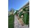 Exterior view of the home's side yard and professional landscaping at 1859 Scarlett Ave, North Port, FL 34289